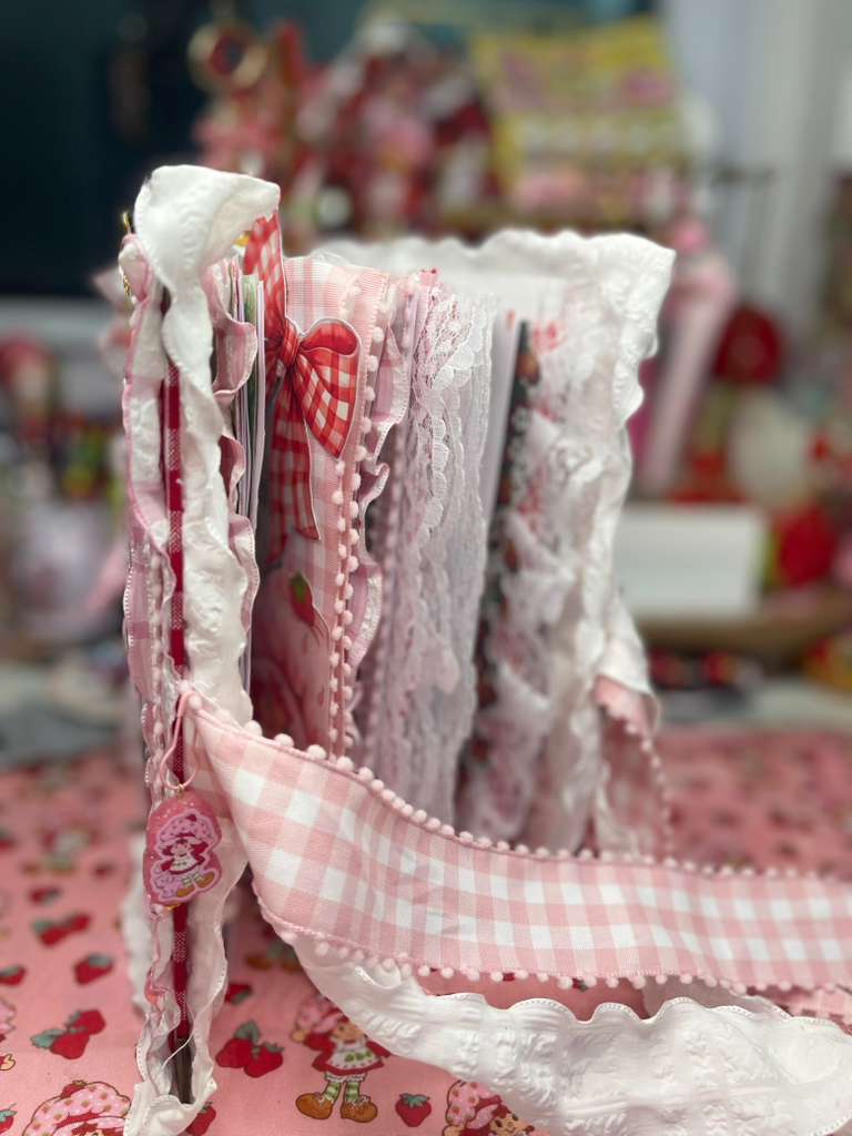 Pages fanned out showing lace edges