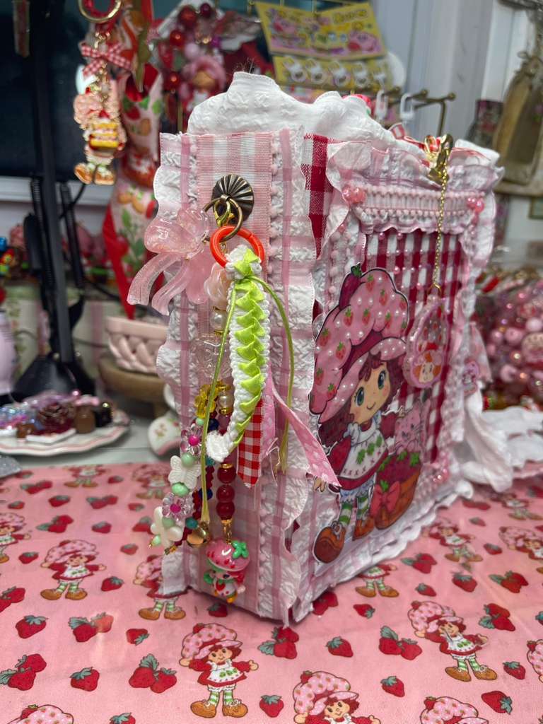 Spine with charm and tassel